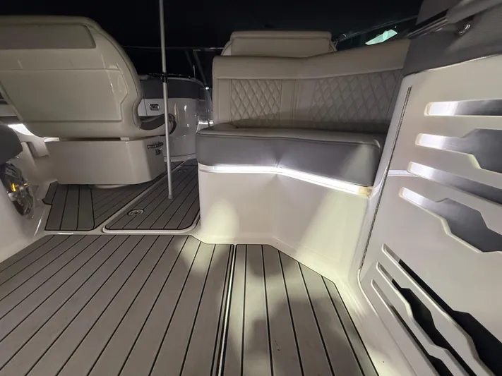 The Good Stuff Yacht Photos Pics 2023 Sea Ray SLX 310 OB interior with elegant seating and modern design.