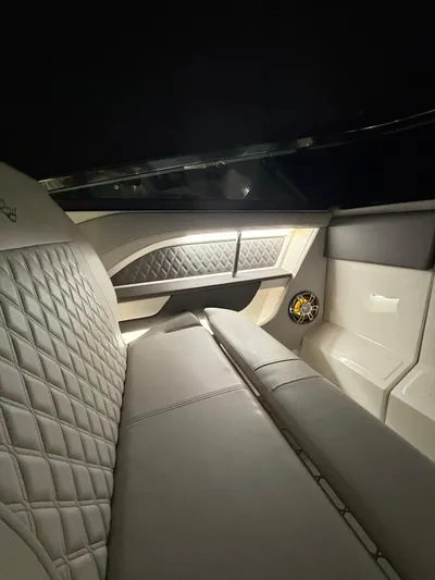 The Good Stuff Yacht Photos Pics 2023 Sea Ray SLX 310 OB interior with quilted seating and ambient lighting.