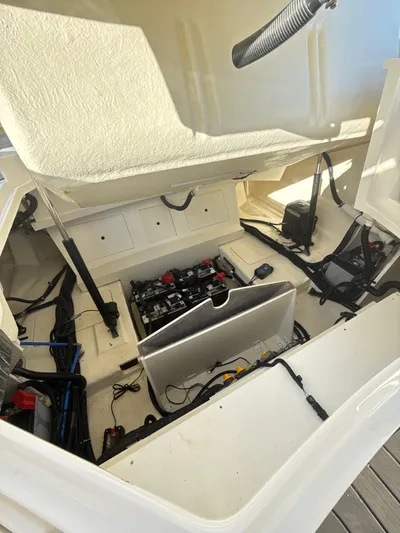 The Good Stuff Yacht Photos Pics 2023 Sea Ray SLX 310 OB engine compartment with visible wiring and components.