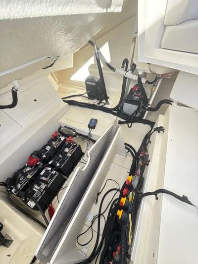 The Good Stuff Yacht Photos Pics 2023 Sea Ray SLX 310 OB boat interior showing battery and wiring setup.
