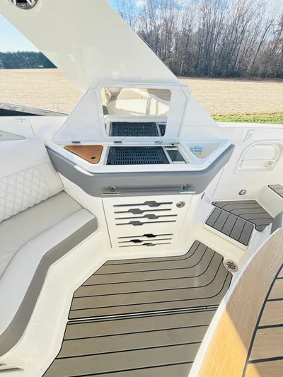 The Good Stuff Yacht Photos Pics 2023 Sea Ray SLX 310 OB interior with sleek seating and modern design.