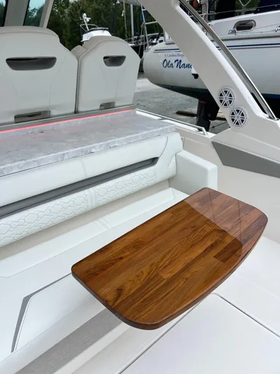  Yacht Photos Pics 2026 Tiara Yachts 34 LS interior with elegant seating and wooden table.