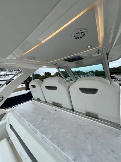  Yacht Photos Pics 2026 Tiara Yachts 34 LS interior with sleek seating and modern design.