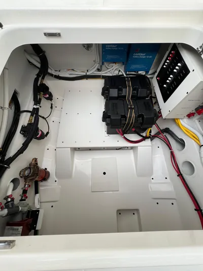  Yacht Photos Pics Engine compartment of 2026 Tiara Yachts 34 LS, featuring batteries and electrical components.