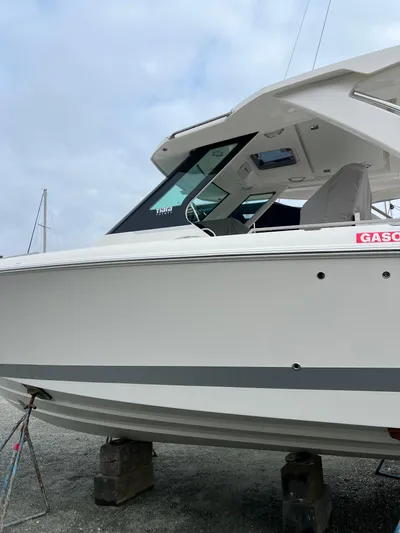  Yacht Photos Pics 2026 Tiara Yachts 34 LS on blocks, side view with overcast sky.