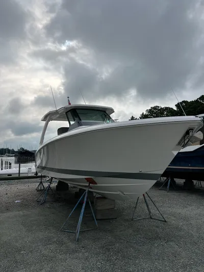  Yacht Photos Pics 2026 Tiara Yachts 34 LS on stands under cloudy sky.