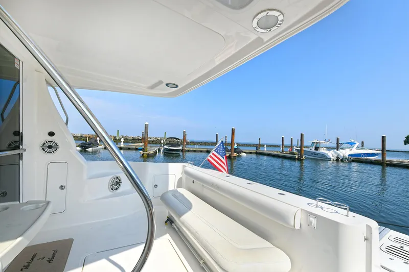 Atlantic Dream Yacht Photos Pics 2008 Sea Ray 44 Sedan Bridge at dock with flag.