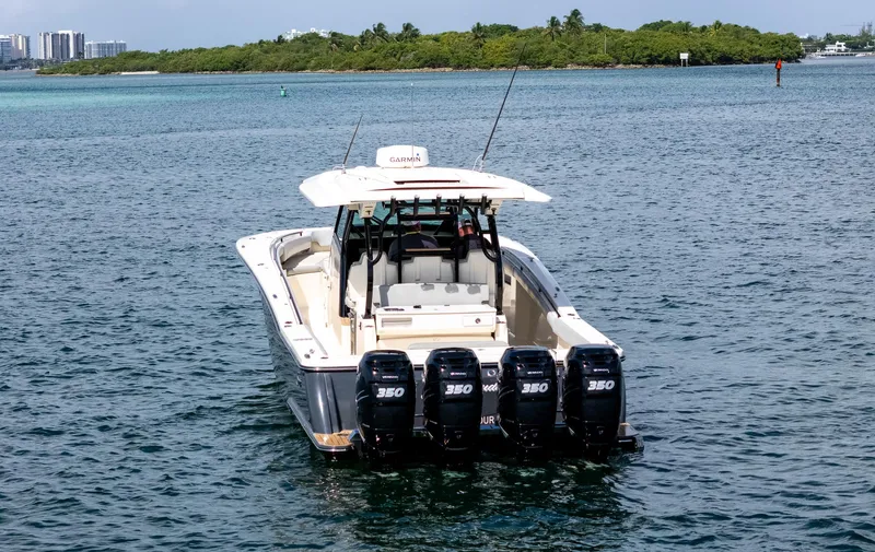  Yacht Photos Pics 2020 Scout 380 LXF boat with four engines on open water.