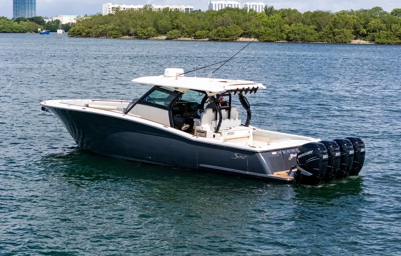  Yacht Photos Pics 2020 Scout 380 LXF boat on water, featuring multiple outboard engines.
