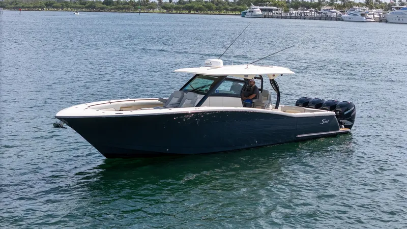  Yacht Photos Pics 2020 Scout 380 LXF boat on water, featuring sleek design and powerful engines.