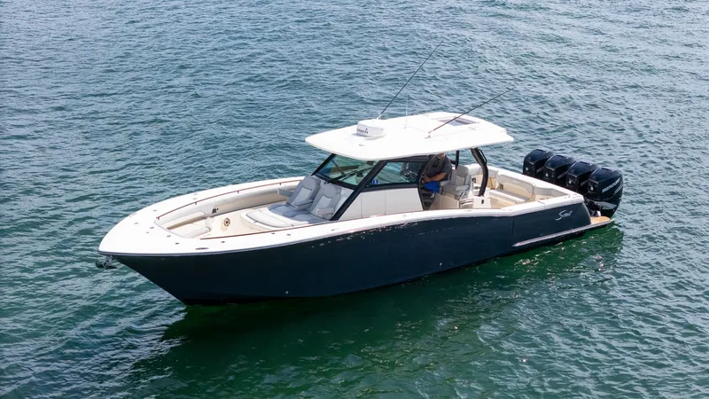  Yacht Photos Pics 2020 Scout 380 LXF boat on water, featuring sleek design and powerful engines.