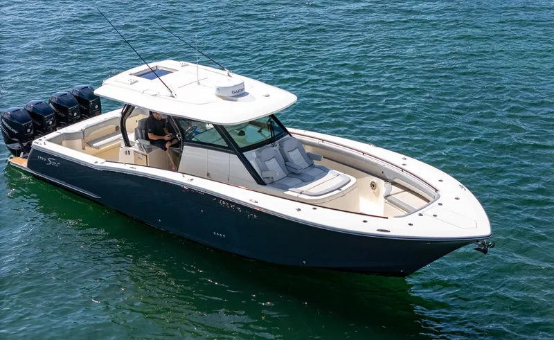  Yacht Photos Pics 2020 Scout 380 LXF boat cruising on clear blue water.