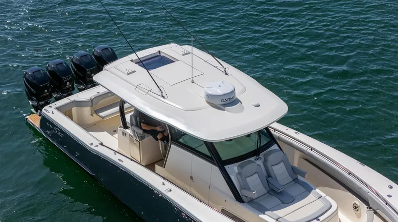  Yacht Photos Pics 2020 Scout 380 LXF boat on water, featuring sleek design and multiple outboard engines.