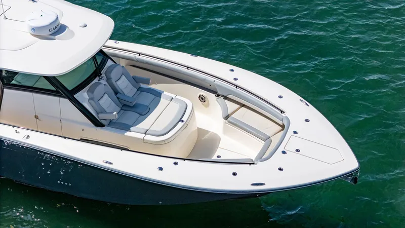 Yacht Photos Pics 2020 Scout 380 LXF boat on water, featuring sleek design and comfortable seating.