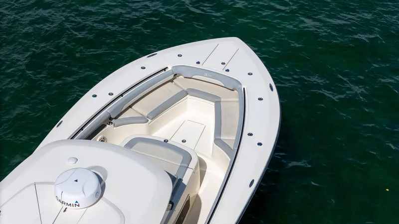  Yacht Photos Pics 2020 Scout 380 LXF boat on clear water, featuring sleek design and spacious seating.