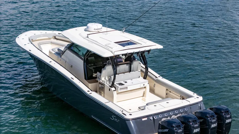  Yacht Photos Pics 2020 Scout 380 LXF boat on water, featuring sleek design and powerful Mercury engines.