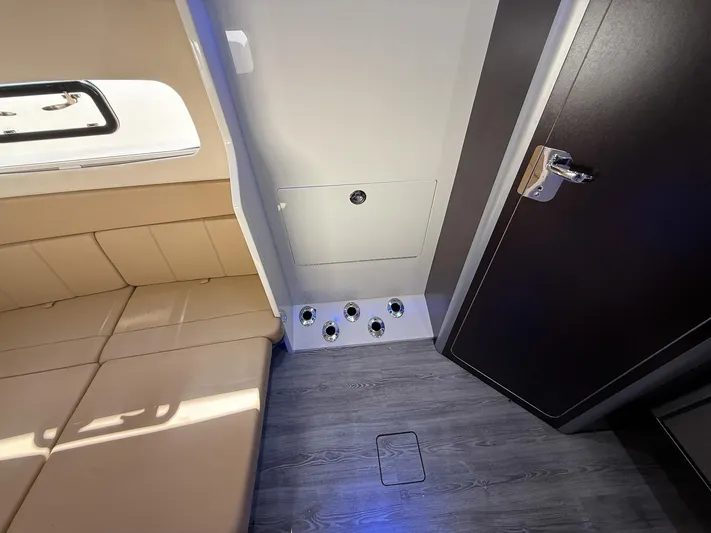  Yacht Photos Pics Interior of 2020 Scout 380 LXF boat with seating and storage compartment.