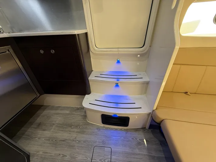  Yacht Photos Pics Interior of 2020 Scout 380 LXF boat with illuminated steps and modern seating.