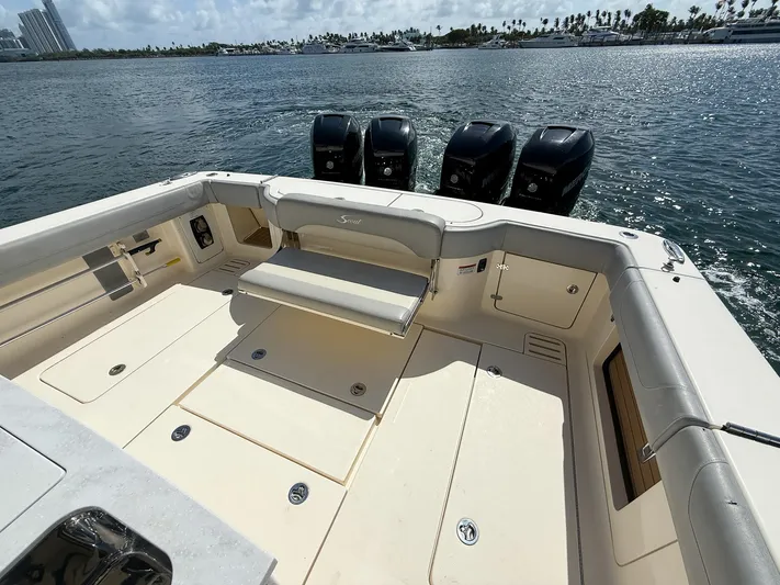  Yacht Photos Pics 2020 Scout 380 LXF boat deck with seating and four outboard engines on the water.