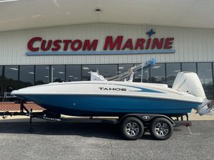 2025 Tahoe 2150 CC boat on trailer at Custom Marine dealership.