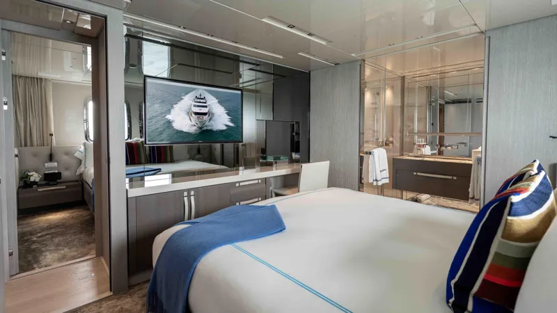 Honey Pot Yacht Photos Pics Luxurious bedroom on 2019 Sanlorenzo SL 106 yacht with modern decor and ensuite bathroom.