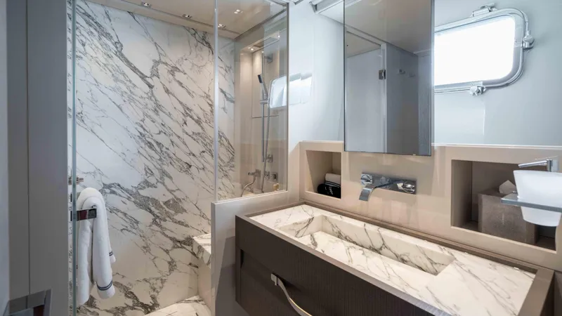 Honey Pot Yacht Photos Pics Luxurious bathroom in 2019 Sanlorenzo SL 106 yacht with marble finishes and modern fixtures.