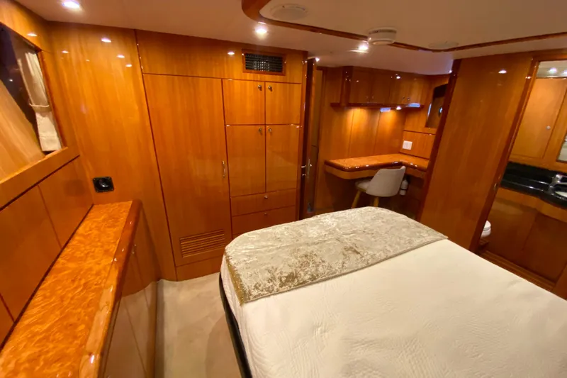  Yacht Photos Pics Luxurious wooden interior of 2001 Compass 57 yacht cabin with bed and desk.