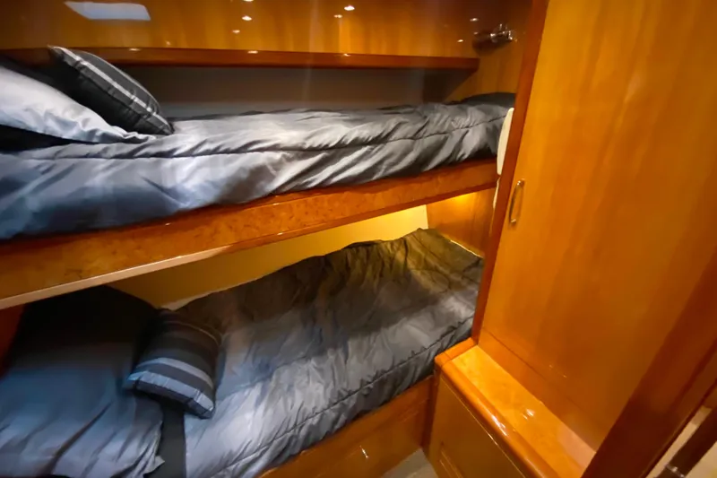  Yacht Photos Pics Bunk beds in a 2001 Compass 57 yacht cabin with wooden interior.