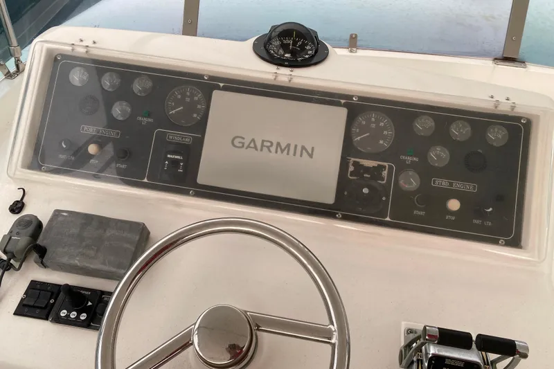  Yacht Photos Pics Boat dashboard with Garmin display, compass, and controls, Compass 57 model, 2001.