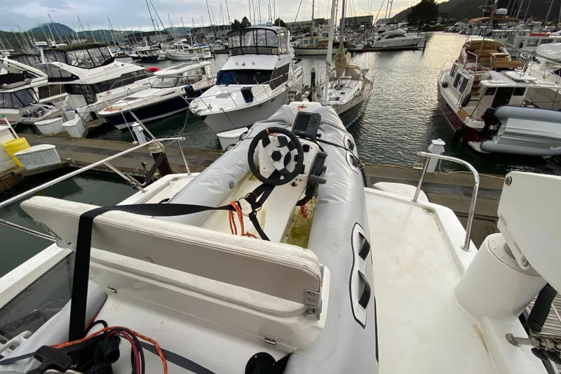  Yacht Photos Pics Inflatable boat on Compass 57 yacht, docked in marina, 2001 model.