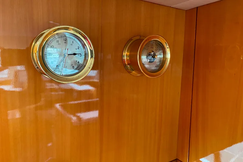  Yacht Photos Pics Gold nautical clock and barometer on polished wooden panel, Compass 57, 2001 model.