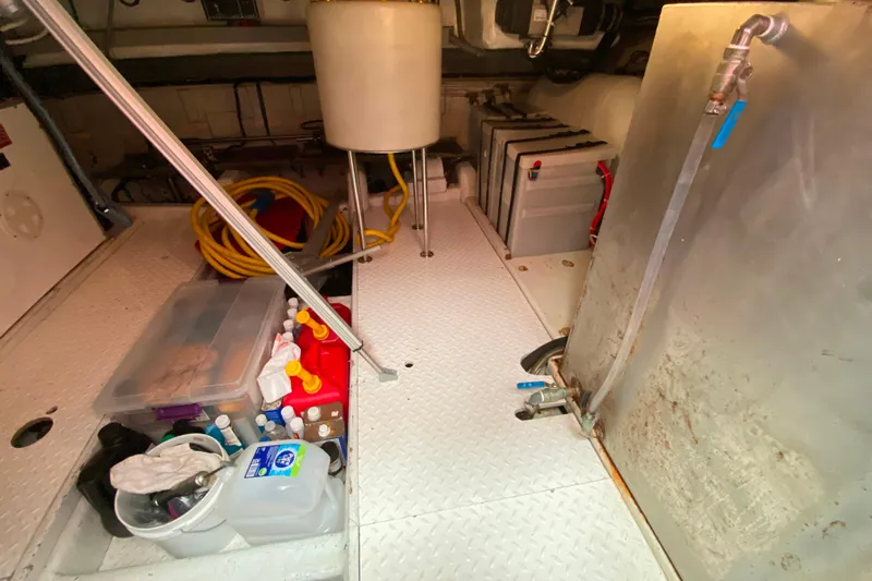  Yacht Photos Pics Engine room of 2001 Compass 57 yacht with storage and equipment.