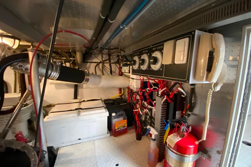  Yacht Photos Pics Engine room of 2001 Compass 57 with control panel, wiring, and safety equipment.