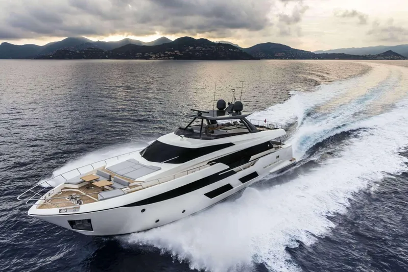  Yacht Photos Pics 2019 Ferretti Yachts 920 cruising on open water with scenic mountain backdrop.