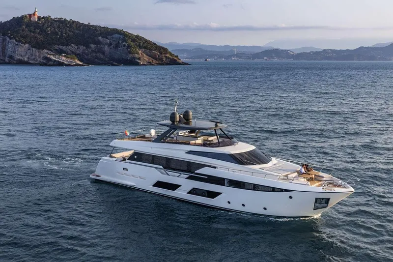  Yacht Photos Pics 2019 Ferretti Yachts 920 cruising near a scenic coastline.