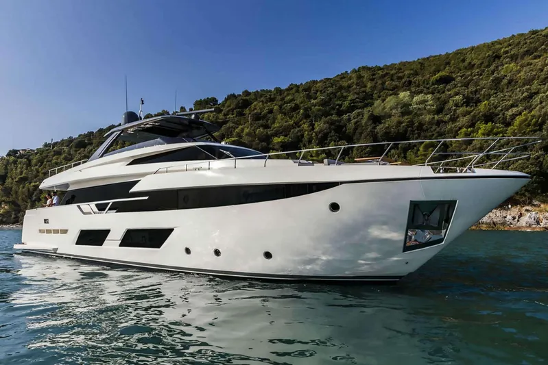  Yacht Photos Pics Luxurious 2019 Ferretti Yachts 920 cruising on serene waters near lush green hills.