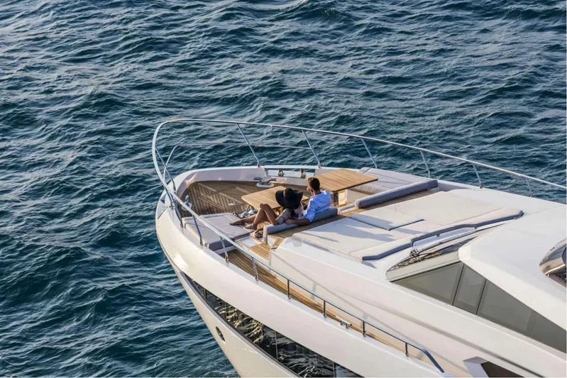  Yacht Photos Pics Couple relaxing on 2019 Ferretti Yachts 920, enjoying ocean view.