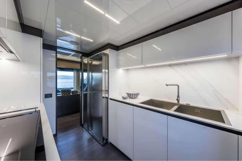  Yacht Photos Pics Modern kitchen interior of 2019 Ferretti Yachts 920, featuring sleek design and stainless steel appliances.