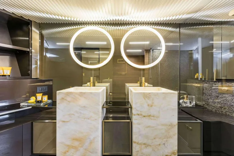 Yacht Photos Pics Luxurious bathroom in 2019 Ferretti Yachts 920 with dual marble sinks and illuminated mirrors.