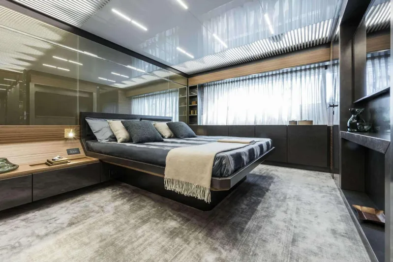  Yacht Photos Pics Luxurious bedroom interior on 2019 Ferretti Yachts 920, featuring modern design and elegant furnishings.