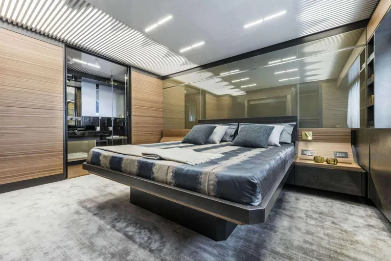  Yacht Photos Pics Luxurious bedroom interior on 2019 Ferretti Yachts 920, featuring modern design and elegant furnishings.