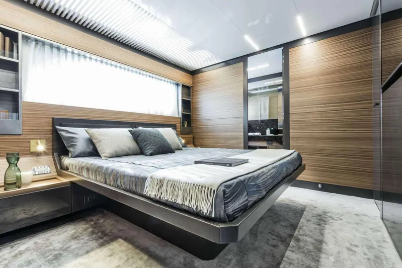  Yacht Photos Pics Luxurious bedroom interior of 2019 Ferretti Yachts 920, featuring modern design and elegant furnishings.