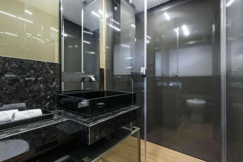  Yacht Photos Pics Luxurious bathroom in 2019 Ferretti Yachts 920, featuring sleek black fixtures and modern design.