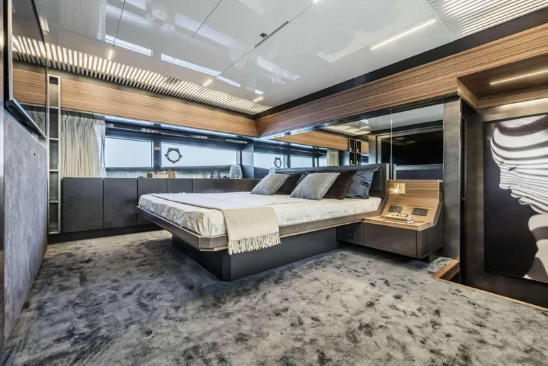  Yacht Photos Pics Luxurious bedroom interior of 2019 Ferretti Yachts 920 with modern design and elegant furnishings.