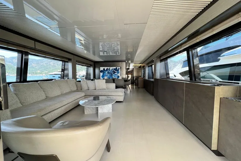  Yacht Photos Pics Luxurious interior of 2019 Ferretti Yachts 920 with modern furnishings and panoramic windows.