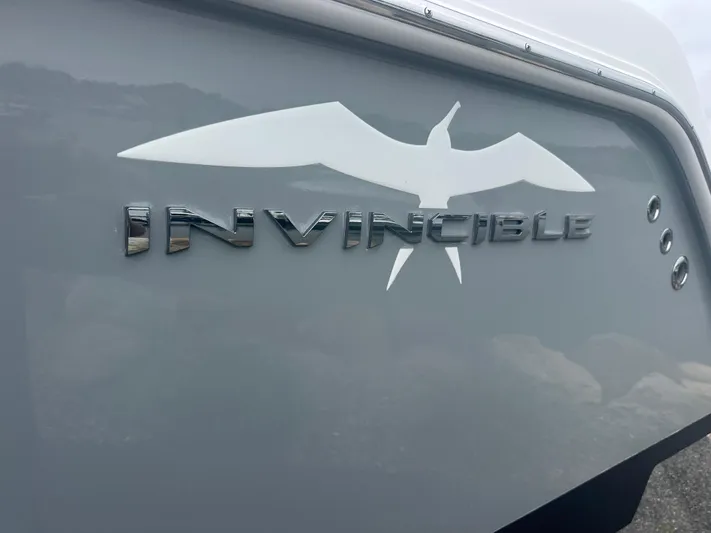 Fly Girl Yacht Photos Pics 2020 Invincible 39 Open Fisherman boat logo with bird silhouette on hull.
