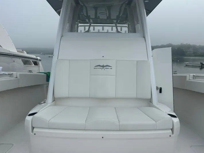 Fly Girl Yacht Photos Pics 2020 Invincible 39 Open Fisherman boat with white seating, docked on a foggy day.