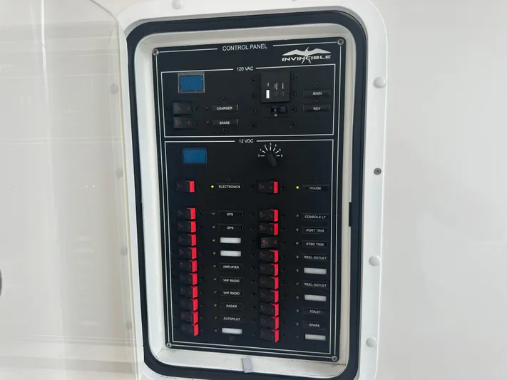 Fly Girl Yacht Photos Pics Control panel of 2020 Invincible 39 Open Fisherman boat with various switches and indicators.