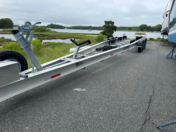 Fly Girl Yacht Photos Pics Trailer for 2020 Invincible 39 Open Fisherman by a scenic waterfront.