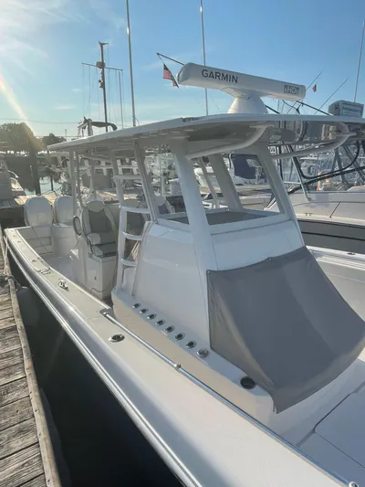 Fly Girl Yacht Photos Pics 2020 Invincible 39 Open Fisherman boat docked, featuring Garmin radar.